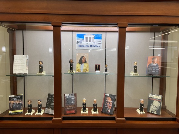 Display case of bobbleheads of Supreme Court Justices