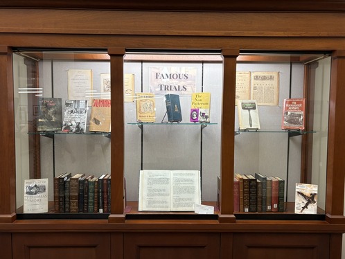 Image of a display case containing books on famous trials