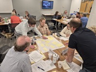 Council members and public participants work together to identify themes from observations in small groups