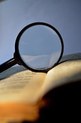 Magnifying glass and dictionary
