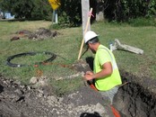 Worker installing broadband wiring