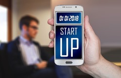 Smartphone with the word startup