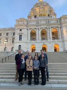 Commissioners standing in front of the State Capitol