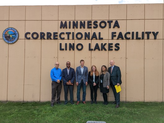 Group photo in front of Lino Lakes Prison