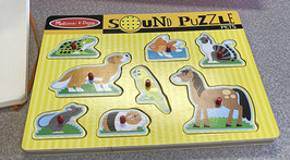 A children's sound puzzle that verbally identifies the animal pieces.