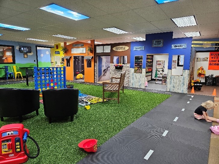a child plays at an indoor playground called Grammy's Town
