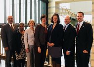 Attendees of the Pacesetter Prize event pose with Minnesota's award.