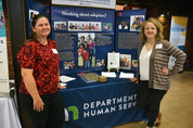 Catrina Ankarlo and Michelle Frazier staff  the department's booth at the annual Celebrate Adoption: Circus of the Heart event 