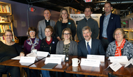 DHS Commissioner Lourey and Lt. Gov. Peggy Flanagan pose with health care roundtable participants