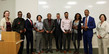 Nine award winners of diverse nationalities with Commissioner Lourey