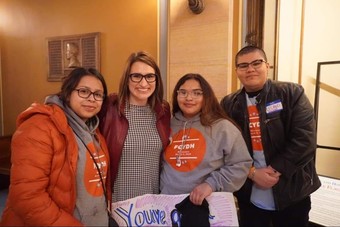 Lt. Gov. Peggy Flanagan with three foster youth