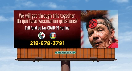 Billboard by Fon du Lac tribal nation regarding COVID hotline