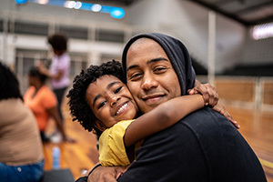 Stock photo of father and daughter at community center