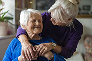 Stock photo of elderly person at home with caregiver