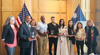 Group photo of 2024 Outstanding Refugee Award recipients with Commissioner Jodi Harpstead and State Refugee Coordinator Rachele King