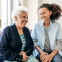 Stock image of older adult with an in-home caregiver