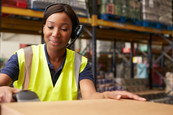 Image of a woman working at a warehouse