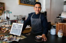 Barista serving coffee