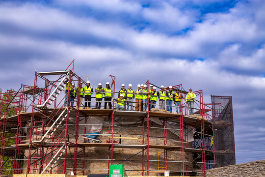 Group of construction workers on a scaffolding