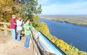 people looking out overlook