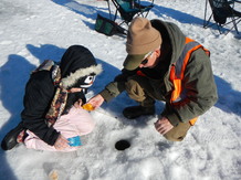 Kid and adult ice fishing