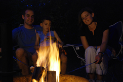 family around campfire