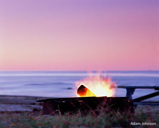 campfire on beach at sunset