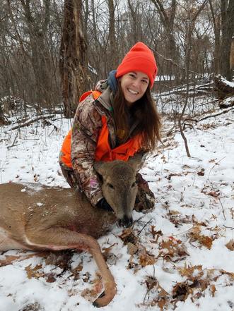 Hunter with a doe
