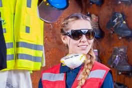 A photo of a woman in safety gear