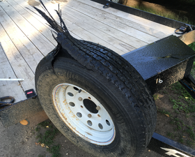 A photo of a ripped tire