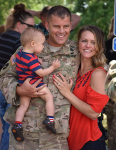 John Peterson with his wife and little boy