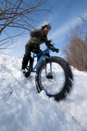 Fat biker on snow-covered trail