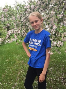 Girl standing near tree in blossom