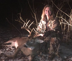 archery hunter with a nice buck she harvested