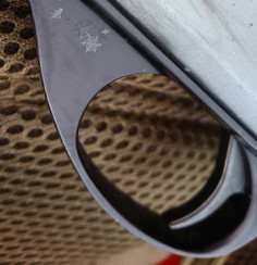 trigger with snowflakes on the gunmetal