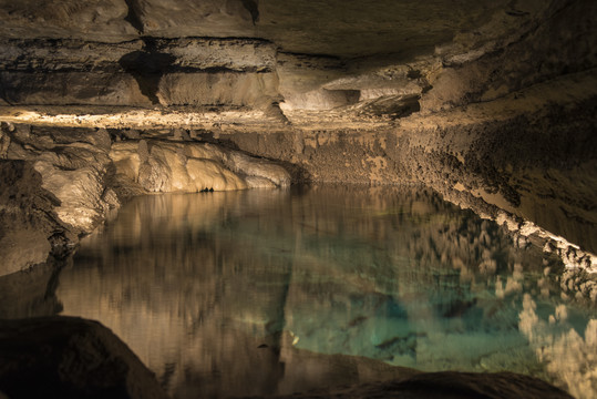 Turquoise lake in Mystery cave.