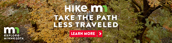 Image of colorful foliage with text that reads "Hike MN. Take the path less traveled" and a button that reads "learn more."