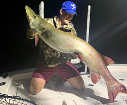 angler holding muskie that tied the state catch-and-release record