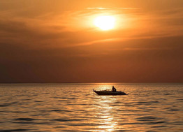 fishing boat on Mille Lacs Lake at sunset