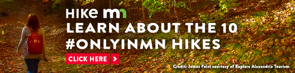 Hike MN, Learn about the 10 #onlyinmn hikes. Image in background of person hiking with backpack in fall color wooded area.