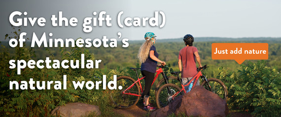 Give the gift (card) or Minnesota's spectacular natural world. Just add nature. Two cyclists looking over tree canopy. 