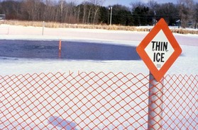 Thin ice sign and view of open water adjacent ice