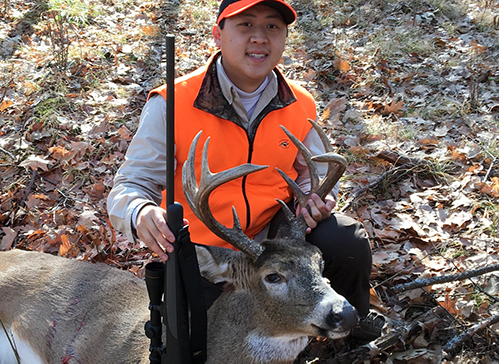 deer hunter with a buck he harvested