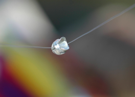 non-lead fishing sinker on a line, close-up photo