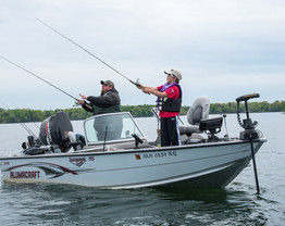 Two people fishing out of a boat on Mille Lacs Lake