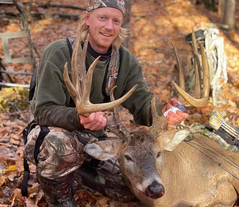 hunter and large buck taken at the 2021 Camp Ripley hunt