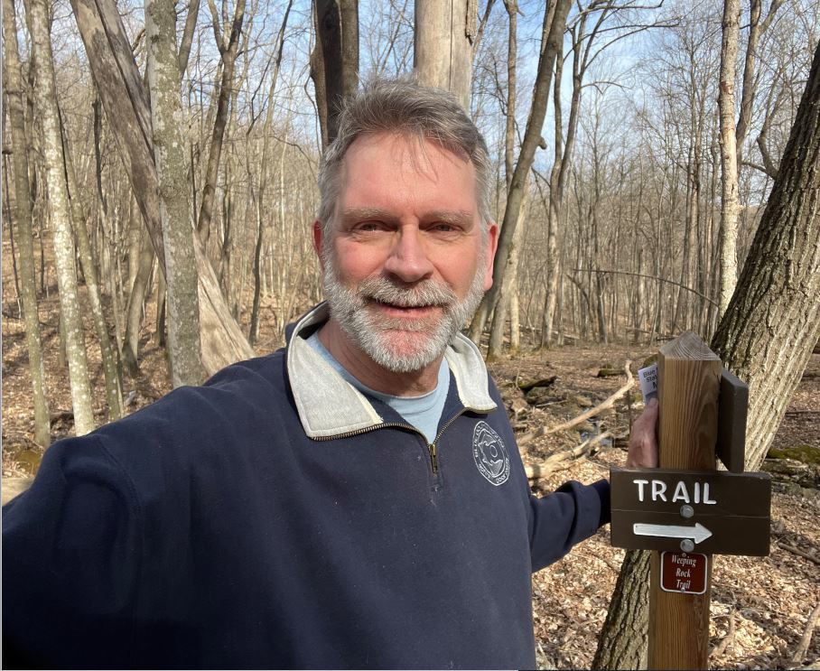 photo of Bill Bleckwenn in a forested area