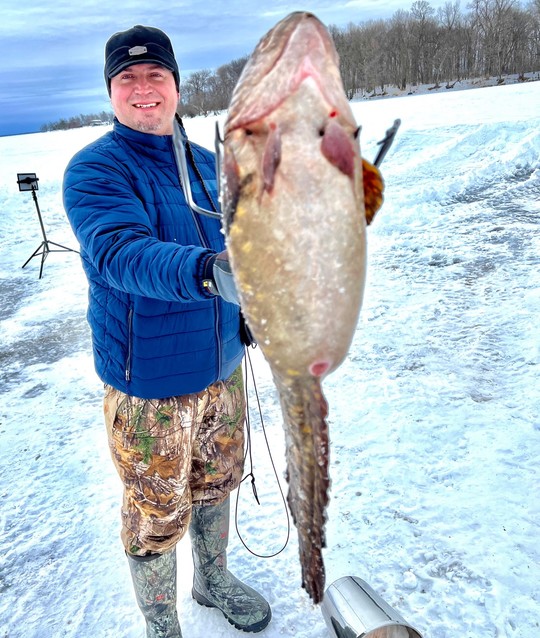 Bradley E. Harrington holding a fish