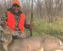 hunter posing with his first deer