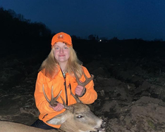 hunter with a deer she harvested